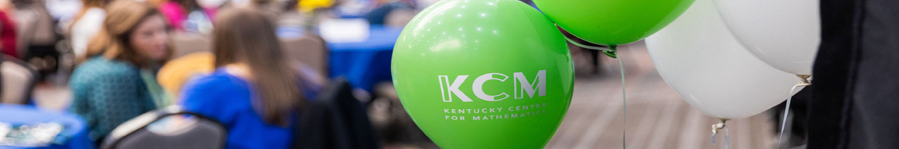 green balloon with KCM logo at a previous conference